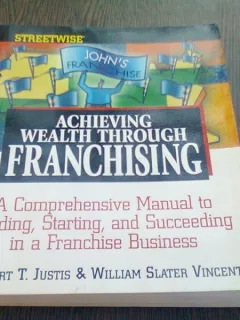 ACHIEVING WEALTH THROUGH FRANCHISING - ROBERT T. JUSTIS  (CARTE IN LIMBA ENGLEZA)