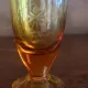 Flacon de bauturi fine cu dop de argint marcat, impreuna cu 5 pahare, cristal galben, perioada interbelica